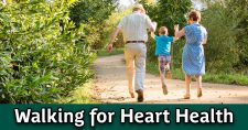 Walking for heart health. Senior couple going for a walk with their grandson.